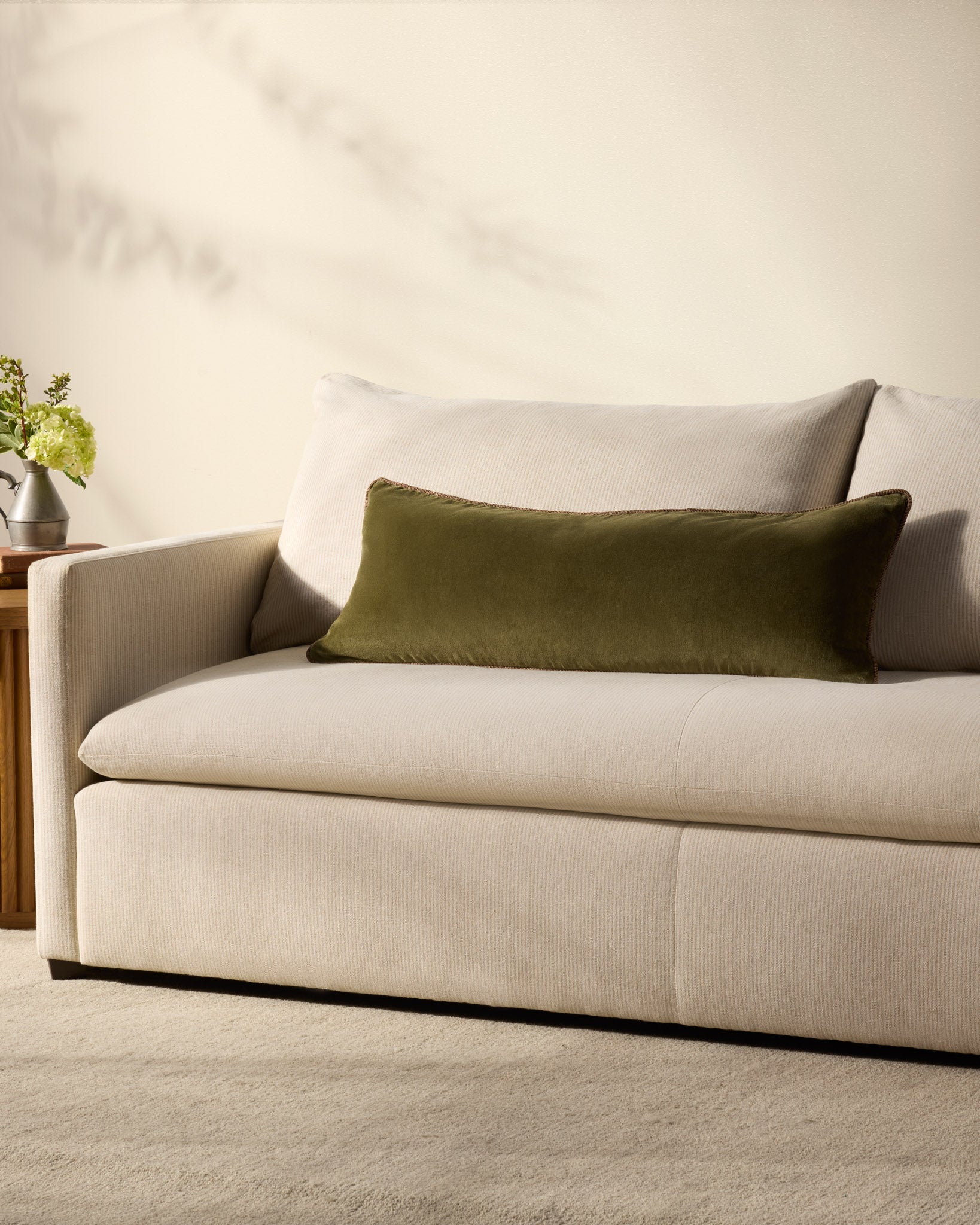 Liza velvet lumbar pillow on a bed