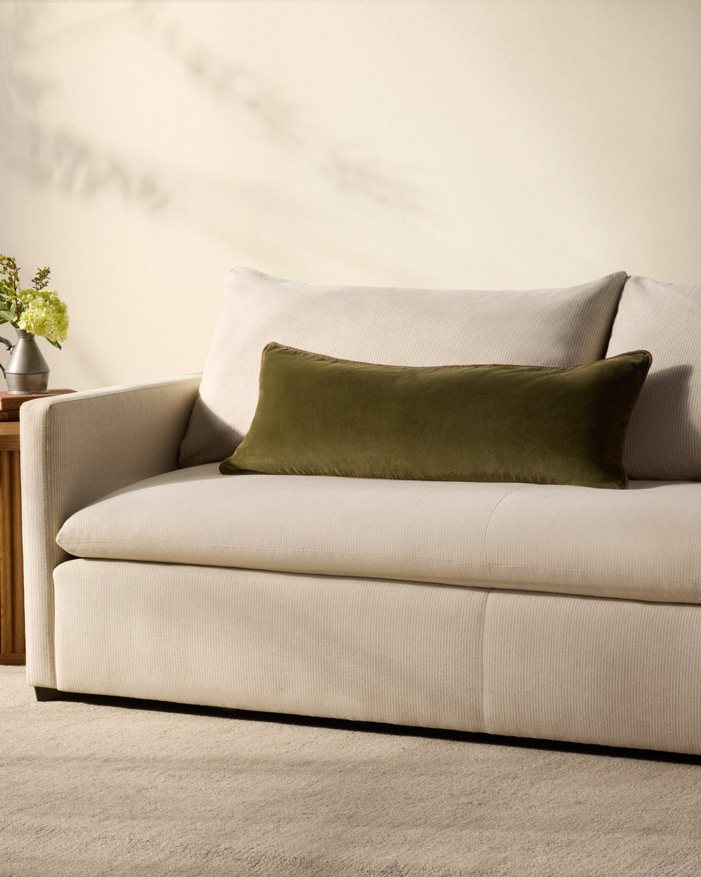 Liza velvet lumbar pillow on a bed
