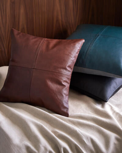 Sheffield pillow styled on a leather sofa