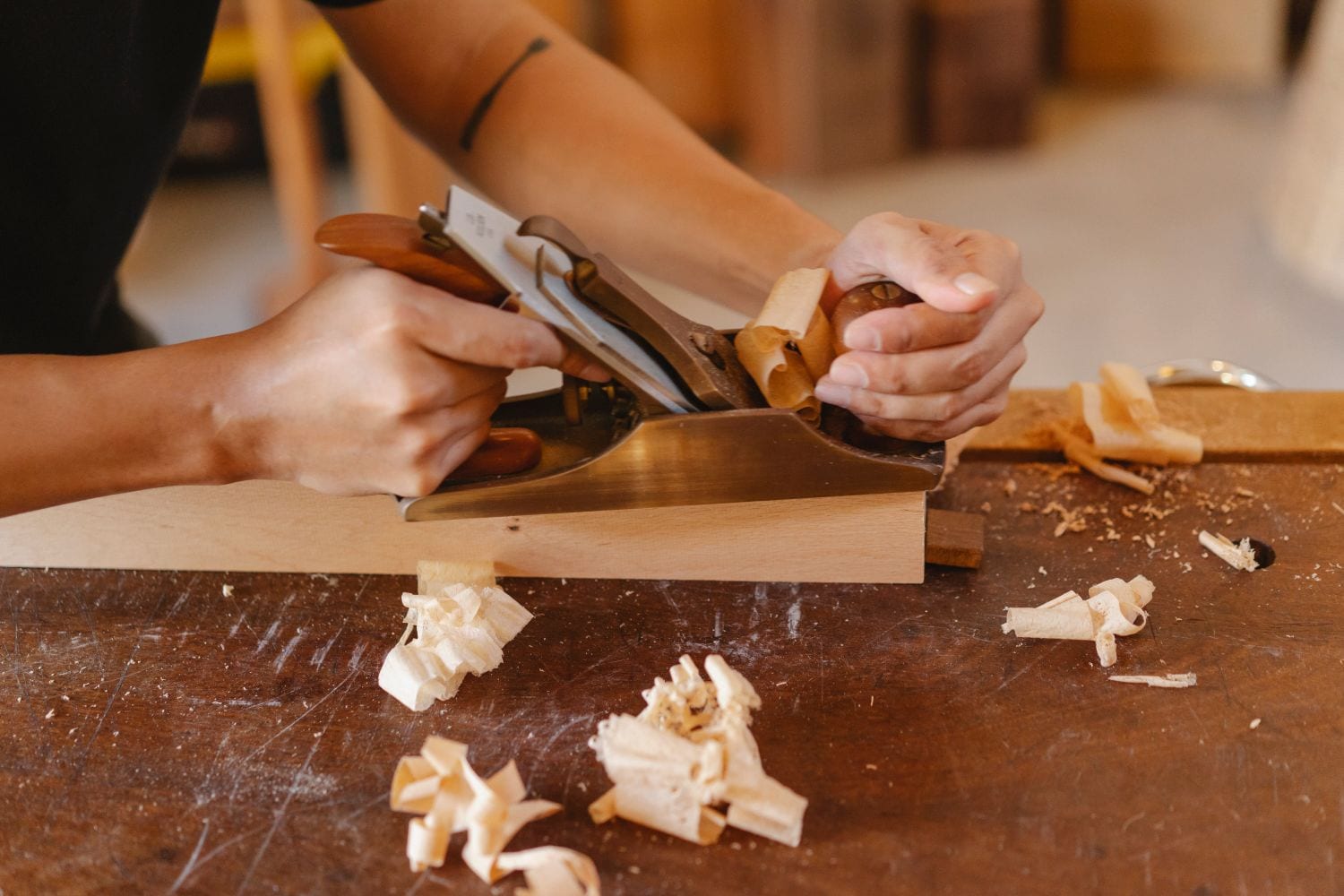 A solid-walnut table being built on a workbench, showing handmade furniture craftsmanship.