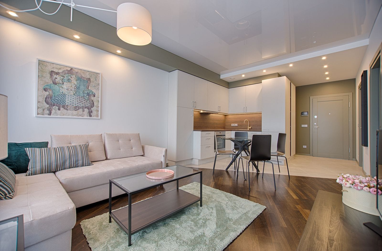 A newly furnished open-plan living area in a new-build home, staged and ready for a walkthrough.